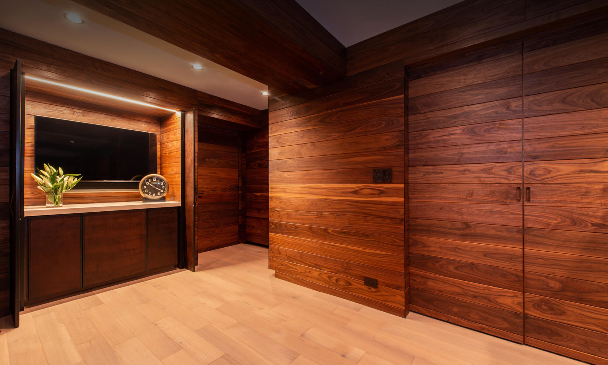 Artistic Construction all-wood wall exercise room with wood sliding doors
