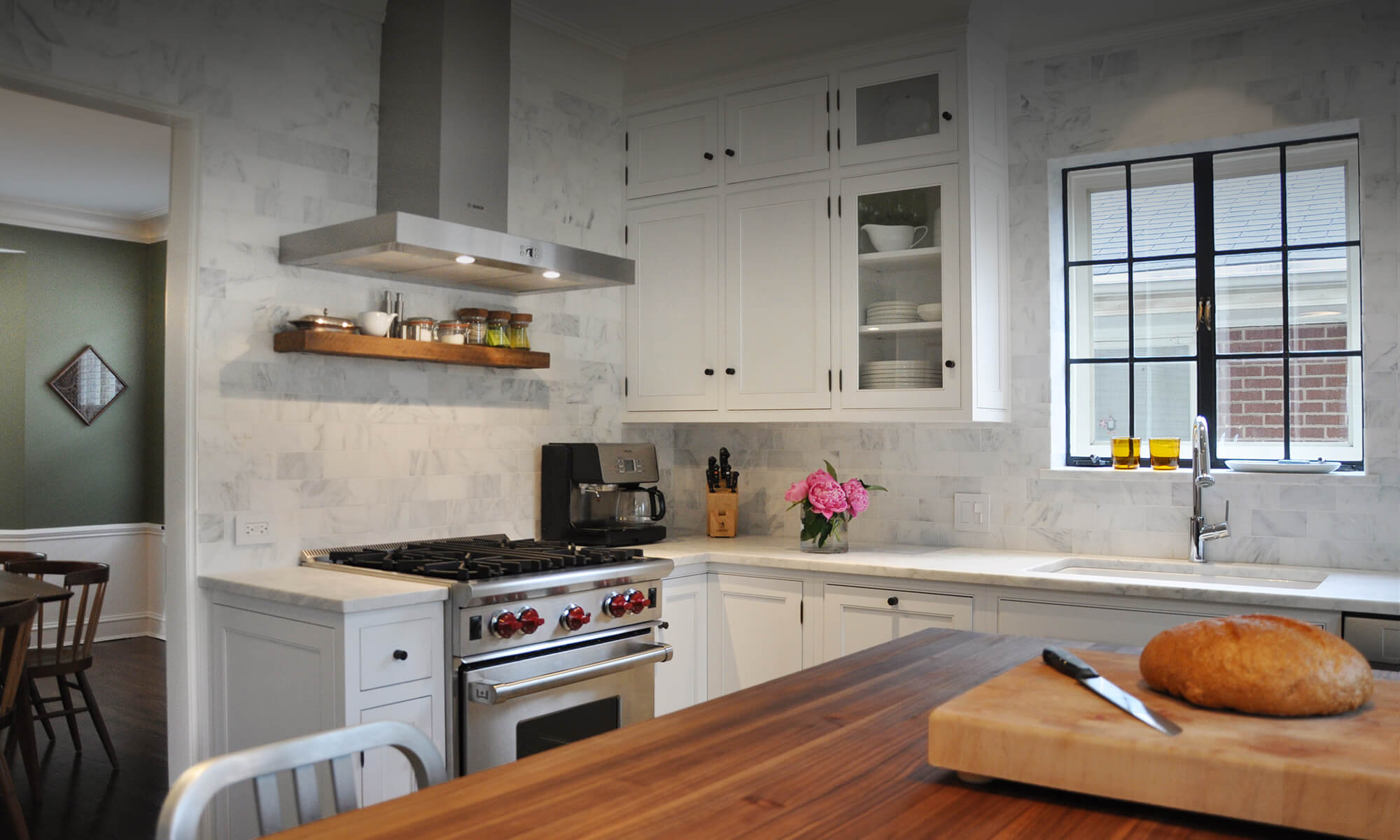 Artistic Construction modern white cabinet kitchen with butcher block island